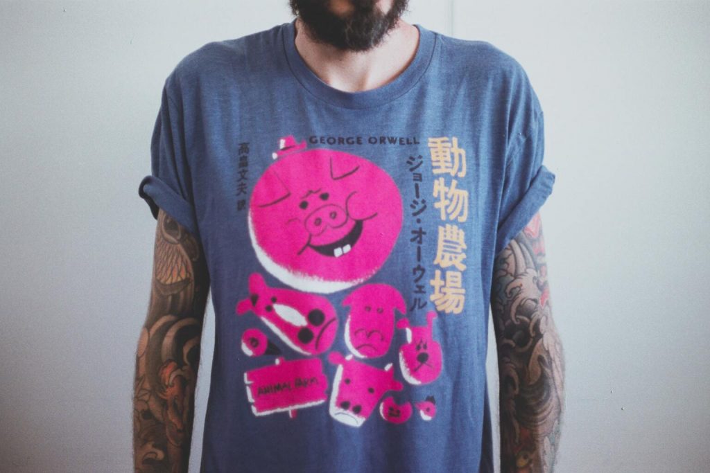 A Man wearing blue and pink angry bird printed t-shirt