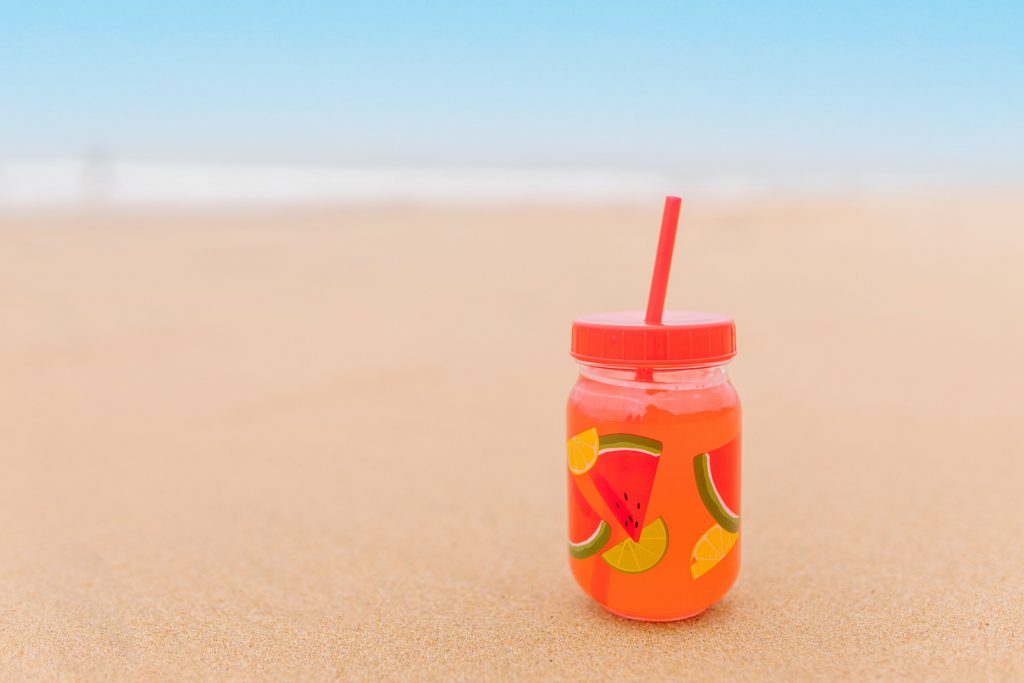 A Refreshment Drink on the Beach Sand
